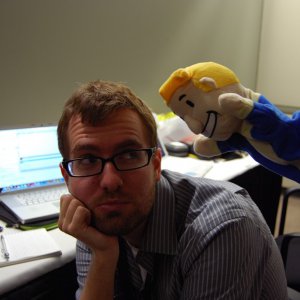 PAX Vault Boy puppet chearing up a weary gaming journalist