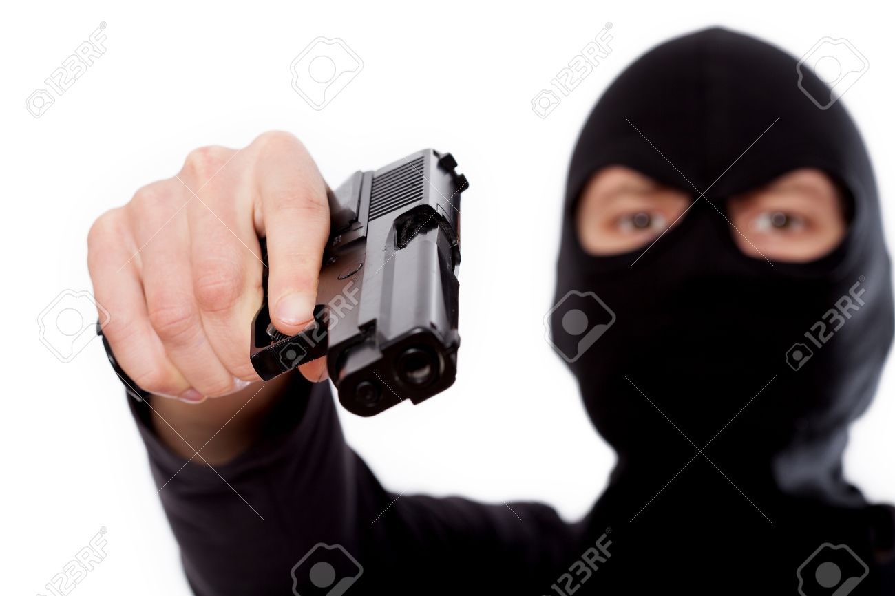 26488645-Terrorist-in-balaclava-is-holding-a-gun-Stock-Photo.jpg