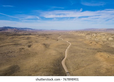 winding-desert-road-viewed-above-260nw-767898901.jpg